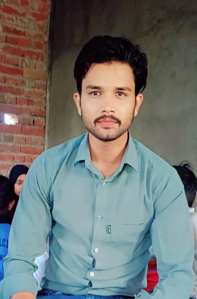 Portrait of Manager Najim Sir in a classroom setting.