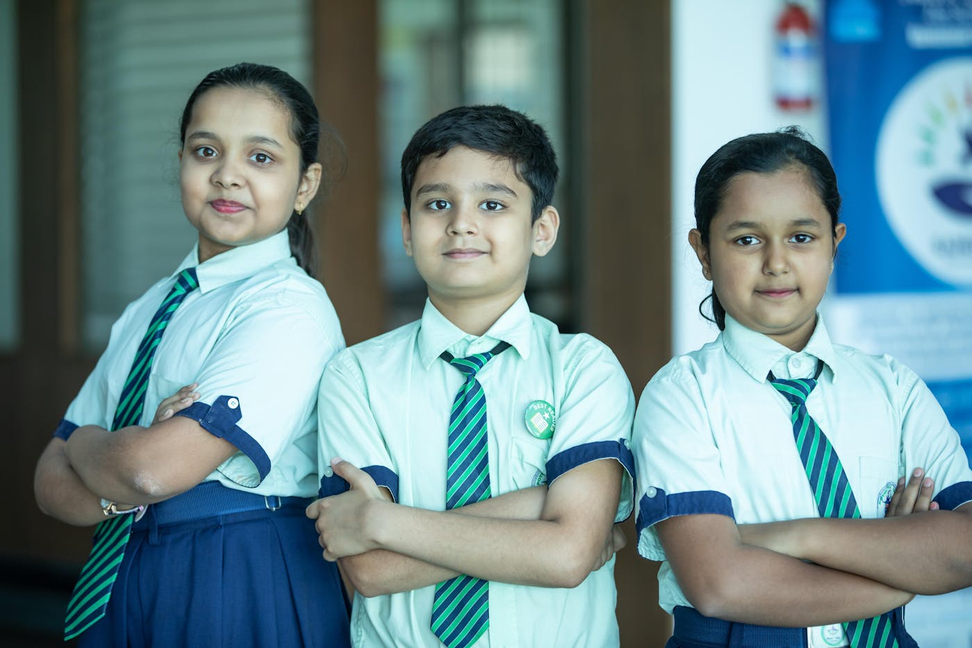 Indian students in school uniform standing confidently together.